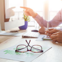 A pair of glasses on a desk