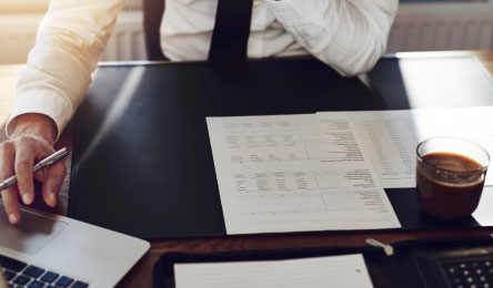 A business man at his desk with paperwork